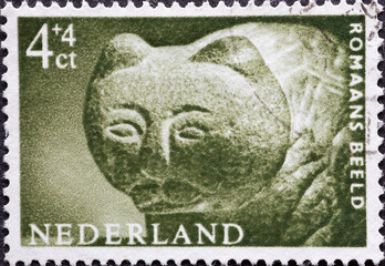 Netherlands - circa 1962: a postage stamp from the Netherlands, showing a historical sculpture of a...