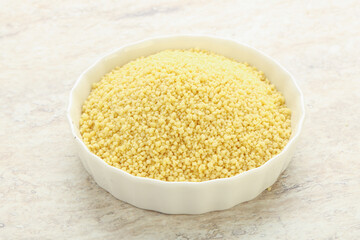 Raw couscous in the bowl
