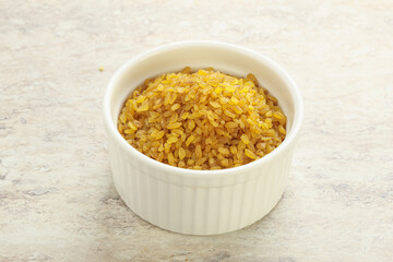 Raw bulgur in the bowl