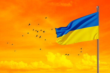 Ukraine flag on the orange sky with bird. Close up waving flag of Ukraine with place for your text. Flag symbols of Ukraine. 3d rendering.