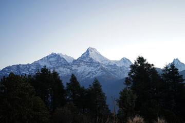 Fototapeta na wymiar Natural landscape of snowcapped mountain view with cloudy blue sky, Annapurna Himalayan range- Nepal 