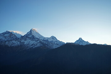 Fototapeta premium Natural landscape of Snowcapped mountain view of Poon hill with colorful prayer flags and blue sky, Annapurna Himalayan range- Ghorepani, Nepal