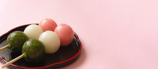 Japanese sweets. Close-up of three-color dumplings. 和菓子。3色団子のクローズアップ