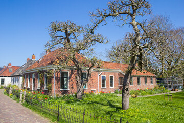 Historic house with colorful front yard in Zuidhorn, Netherlands