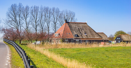 Old farm in the landscape of Friesland, Netherlands