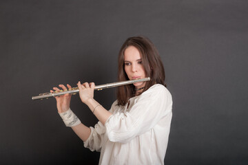 woman playing the flute © Maslov Dmitry