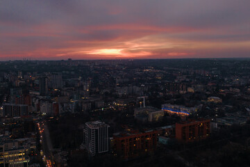 Fototapeta premium Pink sunset over the city of Dnipro. Drone photography. Warm evening city