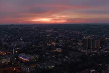 Fototapeta na wymiar Pink sunset over the city of Dnipro. Drone photography. Warm evening city