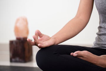  Woman practicing yoga in the room,Lotus pose with mudra gesture,Mindfulness.