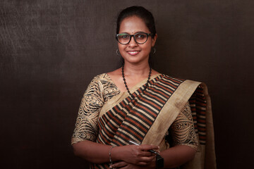 Portrait of a happy woman of Indian ethnicity wearing traditional dress sari