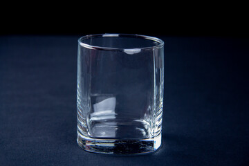Whiskey glass on a black background. Alcohol glassware