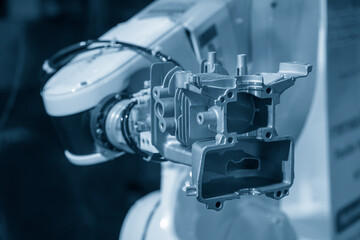 The hi-technology  material handling process by robotic system with cylinder block parts.