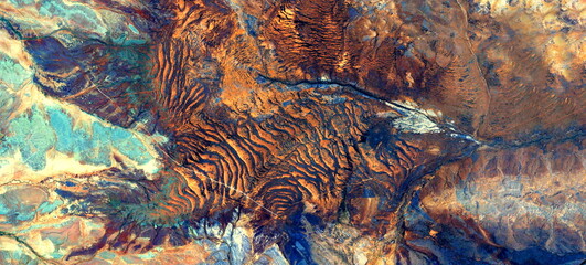 abstract landscape of the deserts of Africa from the air emulating the shapes and colors of the...