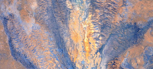 abstract landscape of the deserts of Africa from the air emulating the shapes and colors of the...