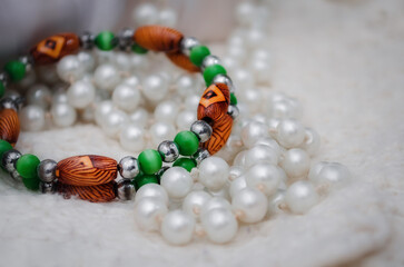 Women's jewelry on a light background. Pearl Bracelets