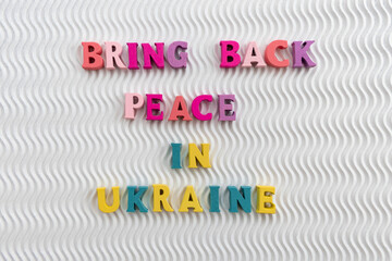 Bring Peace in Ukraine in blue and yellow colors on a white background