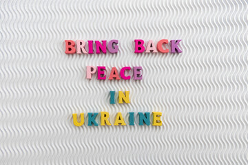 Bring Peace in Ukraine in blue and yellow colors on a white background