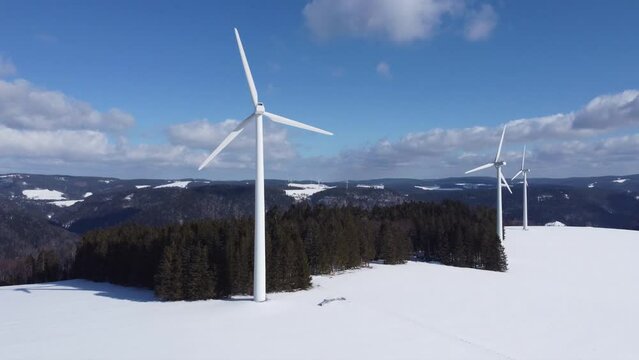 Aerial view of Black Forest with wind energy in snowy winter