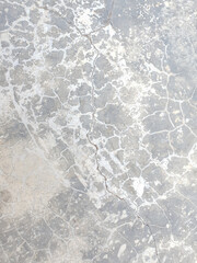 Cracked hard concrete surface with maze like pattern