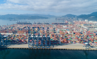 Fototapeta premium Shenzhen ,China - Circa 2022: Aerial footage of container ship in Yantian port in shenzhen city, China