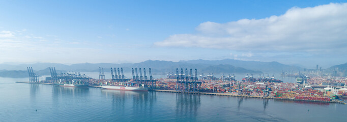 Naklejka premium Shenzhen ,China - Circa 2022: Aerial footage of container ship in Yantian port in shenzhen city, China