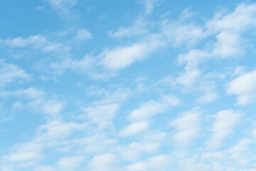Smooth white clouds on clear blue sky background and copy space. Outdoor nature or save the earth concept.