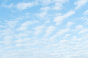 Smooth white clouds on clear blue sky background and copy space. Outdoor nature or save the earth concept.