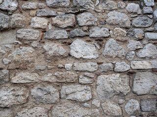 Stone wall texture. Stone wall with mixed size stones and different shapes