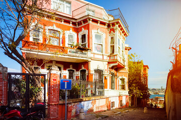Fototapeta na wymiar TURKEY Istanbul, November 2021: Traditional colorful street and houses in Fener district in Balata district. Balat is a popular attraction in Istanbul