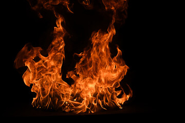 Texture of fire on a black background. Abstract fire flame background, large burning fire.