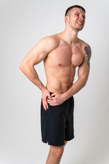 Fototapeta premium Aching hip in a man white background strong ache spine background stress, holding. Tension red sickness, lower suffer attractive
