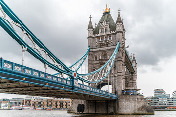 Fototapeta na wymiar Tower Bridge in London - Cloudy day over the Thames river in the UK - British architecture