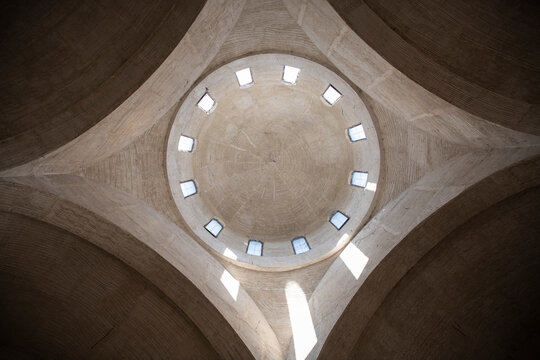 Abstract geometric ceiling background. Inner view of the dome at the church. Concrete ceiling with windows. Architectural roof detail.