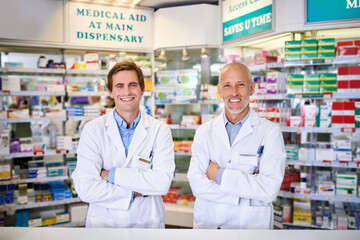 Our quality service comes at no cost. Portrait of two male pharmacists working in a chemist.