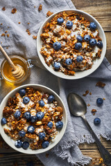 Healthy diet breakfast granola and blueberries with yogurt. Homemade diet granola with yogurt nuts and blueberries for healthy light breakfast.