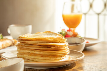 traditional Russian pastries: pancakes for Maslenitsa, pancakes with salmon, pancakes with honey, pancakes for breakfast