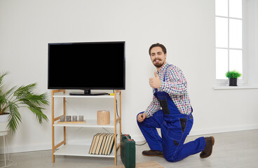 TV installation and connection service. Portrait of professional male technician who repairs,...