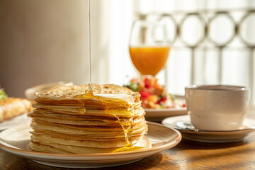 traditional Russian pastries: pancakes for Maslenitsa, pancakes with salmon, pancakes with honey, pancakes for breakfast