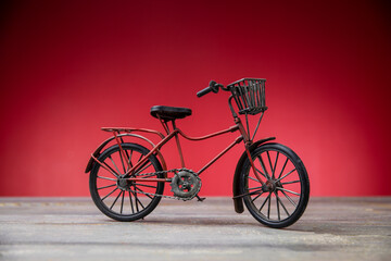 red bike smal size on red background