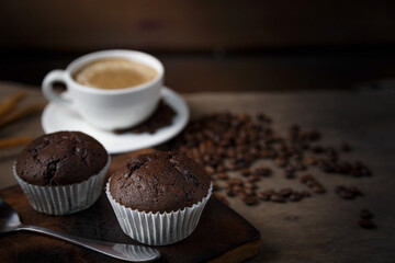 Chocolate cake and a cup of coffee served in the morning.