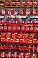 Typical London souvenir fridge magnets including red bus, Beefeater and Union Jack flag.
