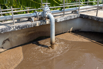 Sewage from drainpipe factory or city flowing to tank for aeration and cleaning of sewage...