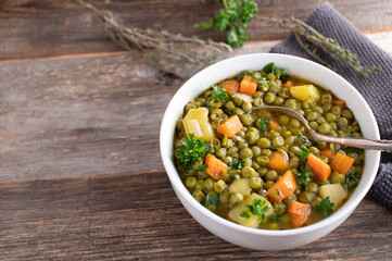 Vegetarian stew with green peas, vegetables and potatoes 