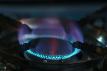 Blue flame of burning butane gas on a stove - obrazy, fototapety, plakaty