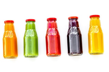 vegetable and fruit juice in bottles for diet drink on white background top view mock up