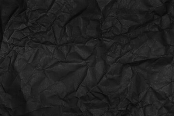 black crumpled paper texture as background