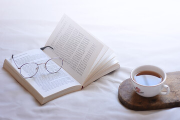 Fototapeta premium cup of coffee and book