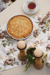 Table with apple pie, fruits snacks. Spring concept