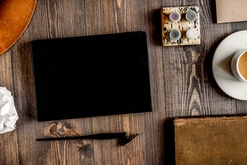Obraz na płótnie Canvas Writer workplace with tools on wooden background top view