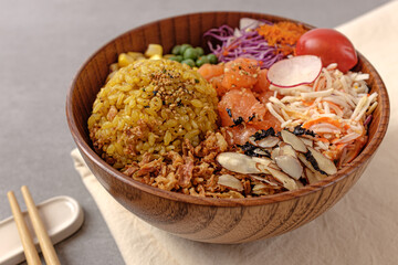 Hawaiian food poke with rice, salmon and vegetables